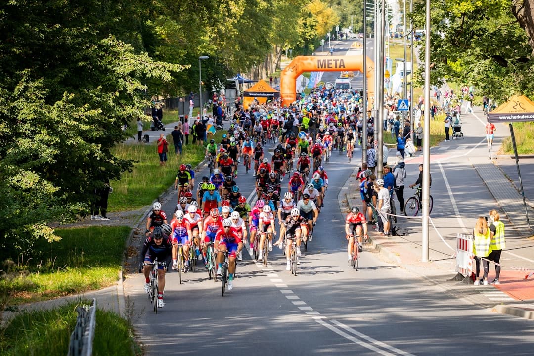 Runners competing in a marathon race on an open road during daylight