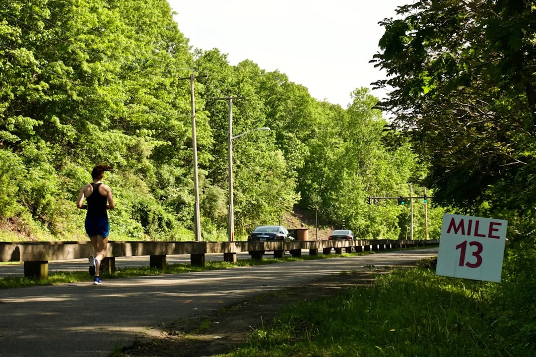 Group of diverse runners at the starting line of a parkrun event in the UK