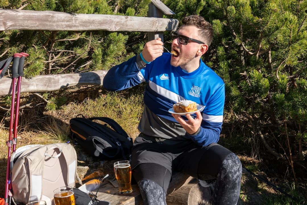 Marathon runner eating a large bowl of pasta the night before race day