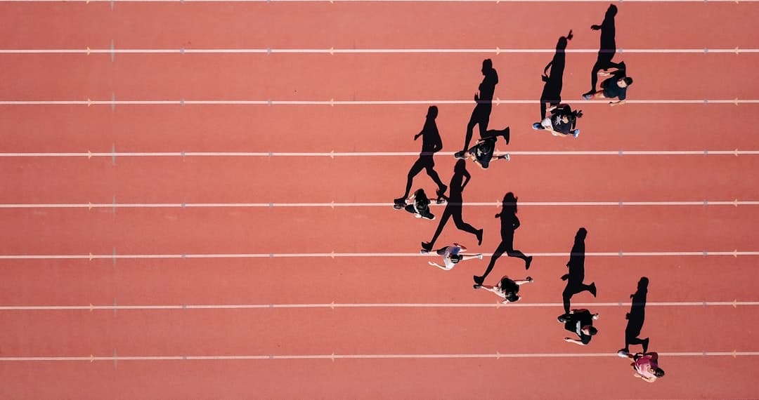 Competitive runners sprinting towards the finish line during a 5K race