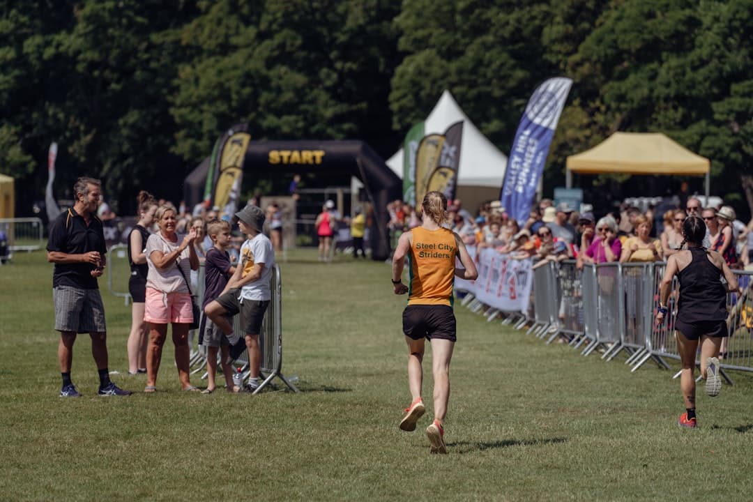 Runners competing in a UK half marathon race on a road course